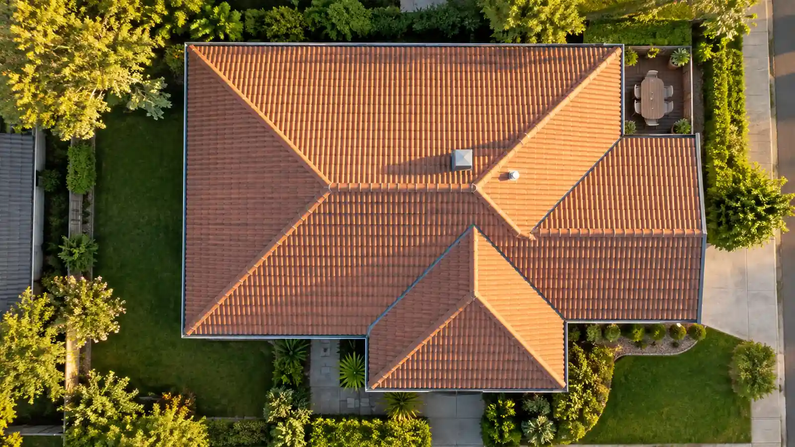 Aerial view of a terracotta roof used to measure gutters for a fixed roof and gutter cleaning quote